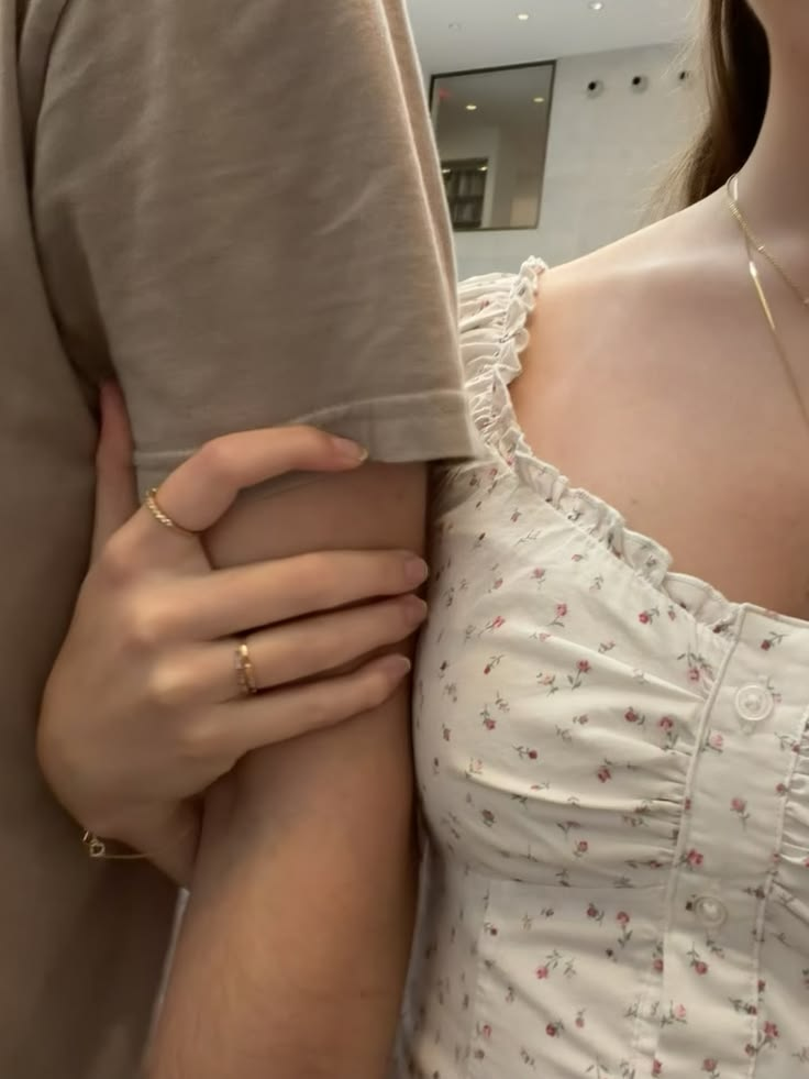 Two people standing closely together